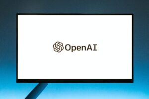 a computer monitor with "OpenAI" written on it